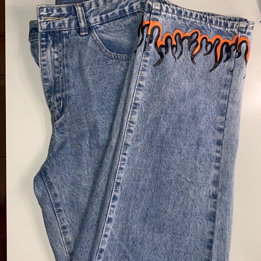 Unworn straight jeans w fire designs on ankles